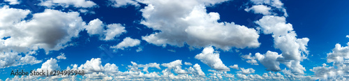 Panorama Sunlight with blue sky on dark background.Vivid sky on white cloud.