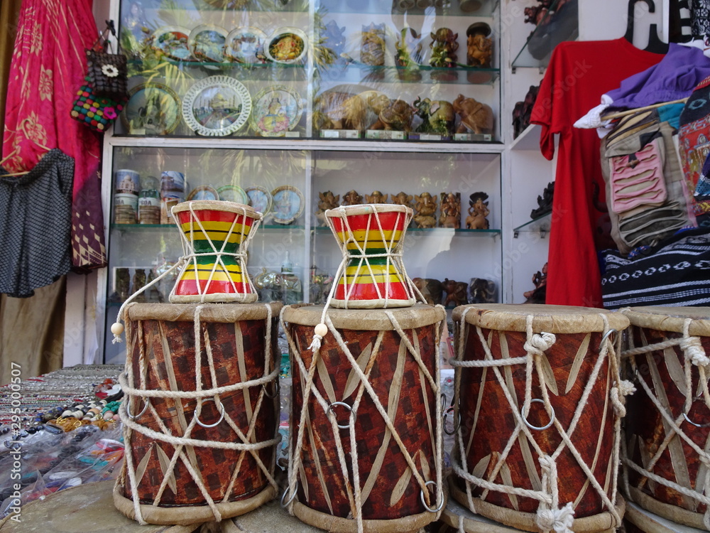 musical instruments and other gift items displayed outside of a souvenir shop in Colva, Goa, India