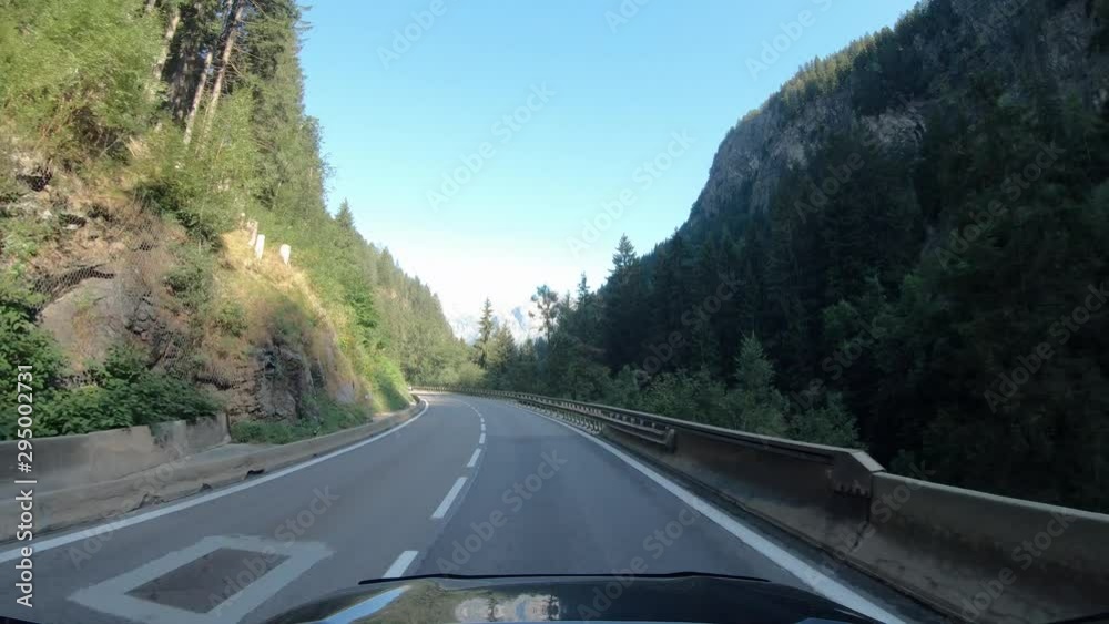 Summer road trip on Europe, first-person view of a moving car on a highway, natural landscape. Summer road trip on Europe, first-person view of a moving car on a highway, natural landscape.