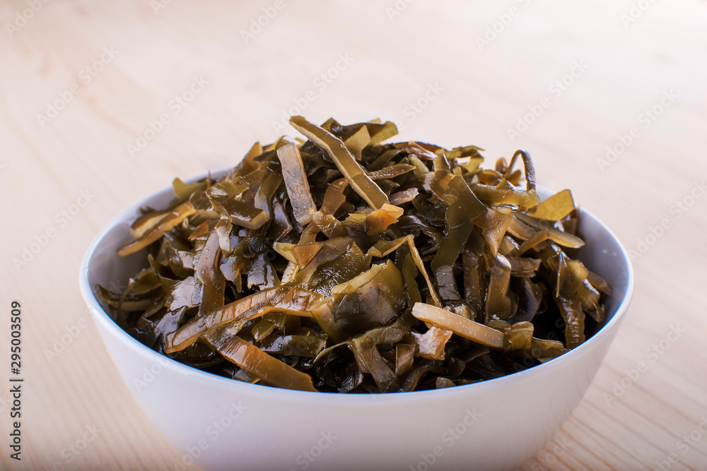 Ceramic bowl with marinated sea kale, view from above Ceramic bowl with marinated sea kale, view from above