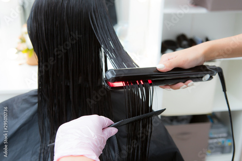 Keratin recovery hair and protein treatment pile with professional ultrasonic iron tool.