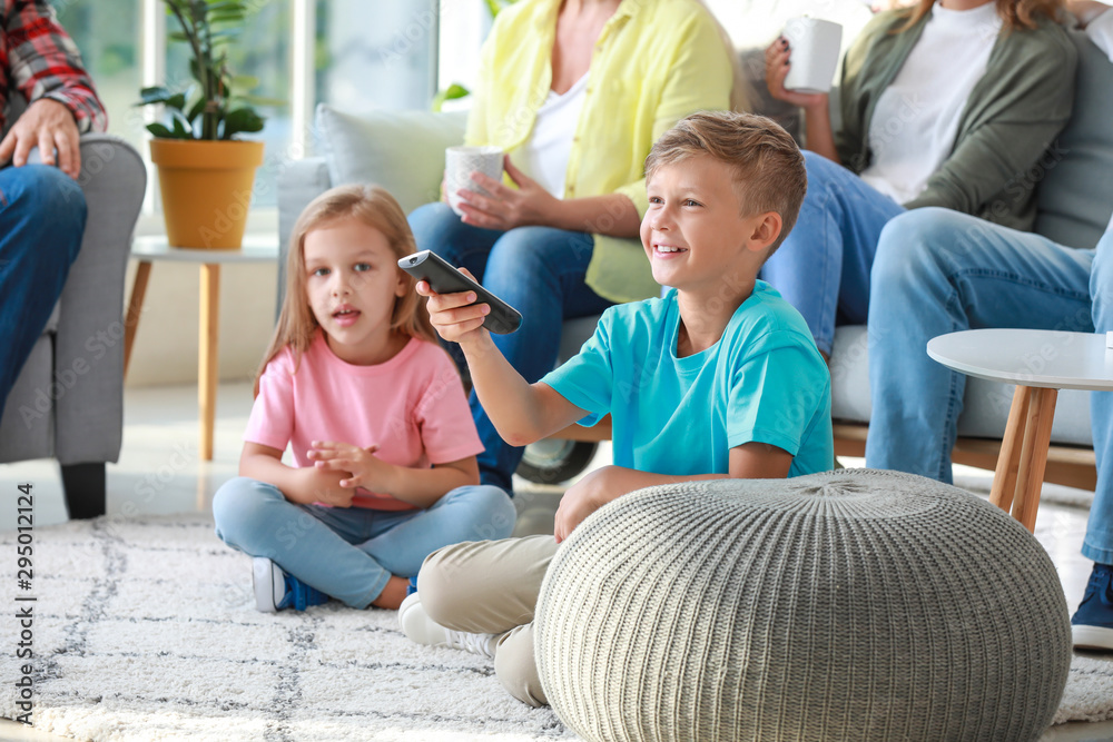 Big family watching TV together at home Big family watching TV together at home