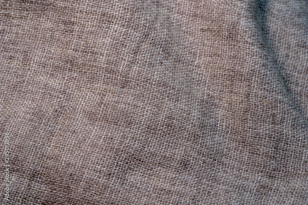 Crumpled textile texture as a background. Natural fabric linen texture for design. Closeup Crumpled textile texture as a background. Natural fabric linen texture for design. Closeup