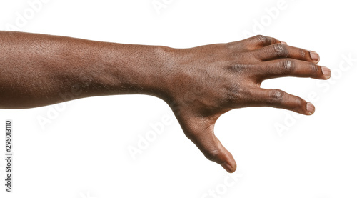 Hand of African-American man holding something on white background