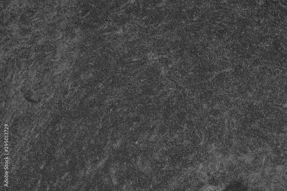 Fototapeta premium Pumpkin cut in half with the texture of pulp. Pumpkin slices background closeup, top view. Black and white
