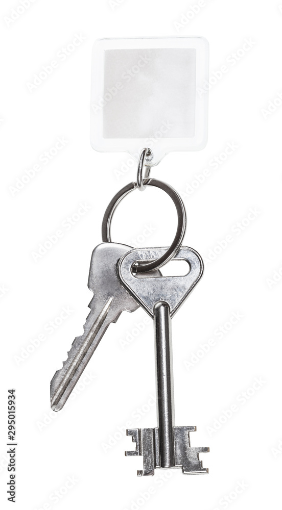 steel keys on keyring with blank keychain isolated steel keys on keyring with blank keychain isolated