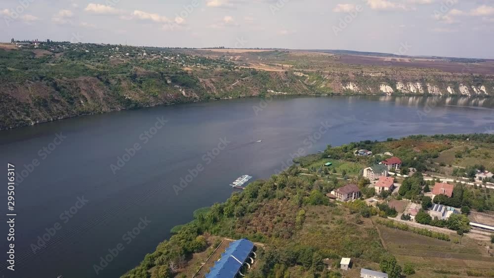 Flight over the river and small village in autumn. Moldova republic of. Molovata village. River Dniester. Flight over the river and small village in autumn. Moldova republic of. Molovata village. River Dniester.