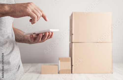 Delivery Man using tablet. Products, Commerce, Retail