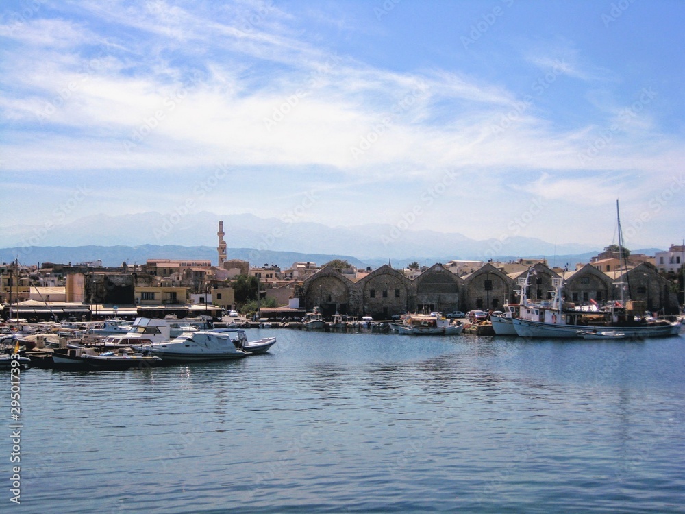 The coastal area, old harbour and the characteristic Venetian buildings in Chania town, Crete, Greece.