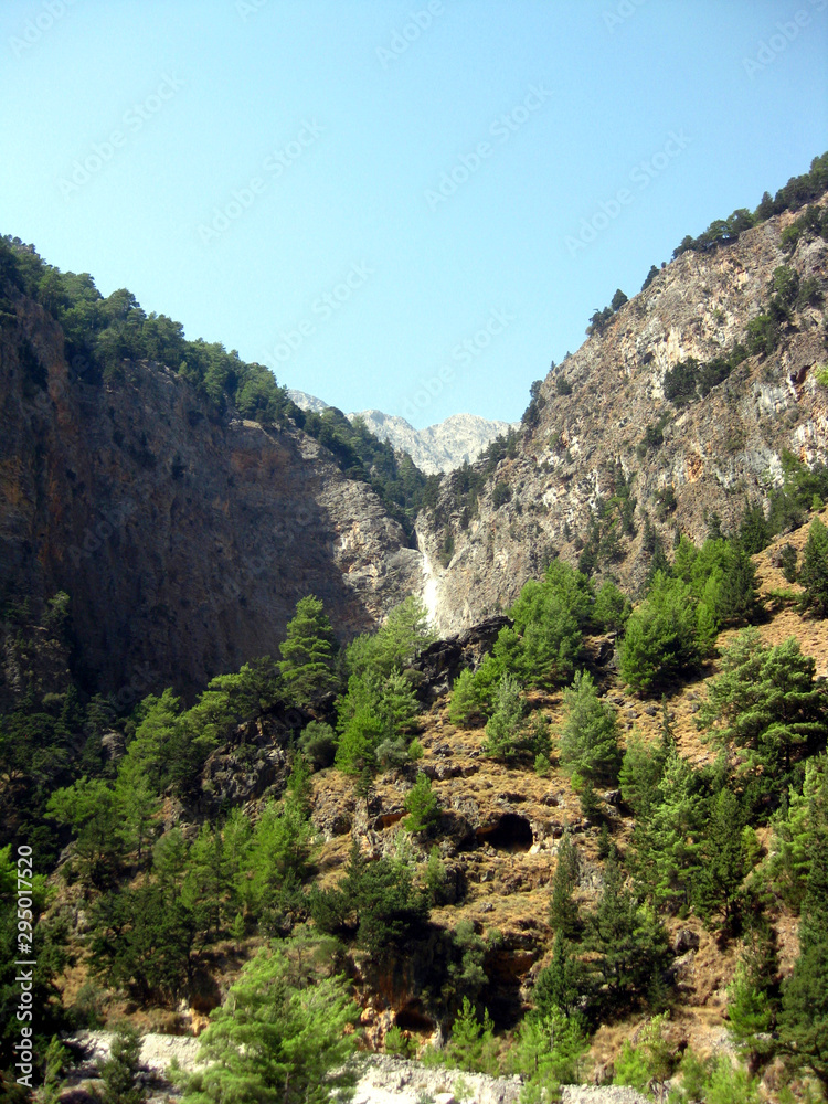 Hiking through the famous Samaria Gorge in the White Mountains on the island of Crete, Greece. A major tourist attraction of the island 
