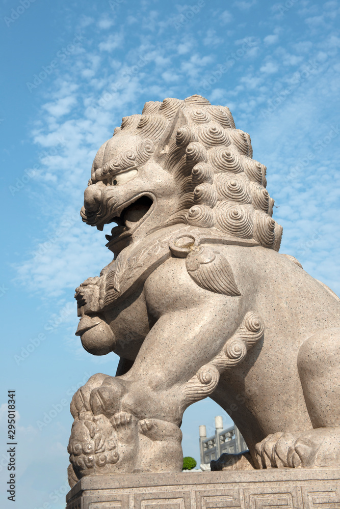 close up of Lion Guardian sculpture at Chinese style temple in Thailand