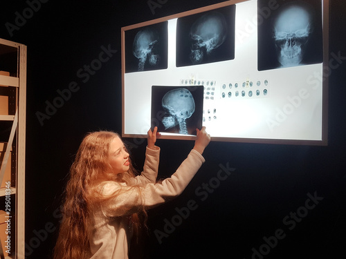 close up.pretty girl detective by comparing the fingerprints photo