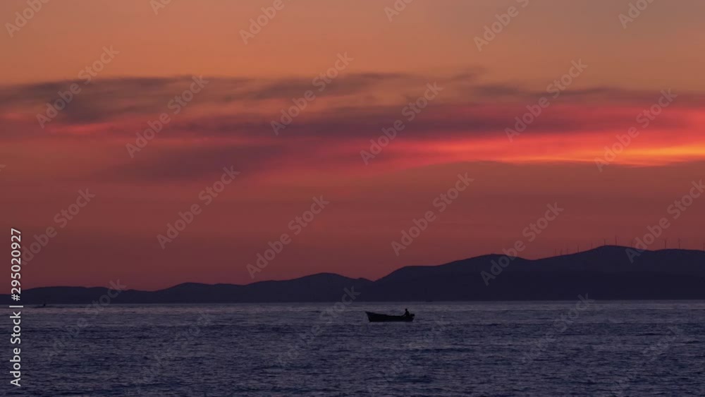 Twilight on the Adriatic Sea. Silhouettes of boats floating on the sea. Twilight on the Adriatic Sea. Silhouettes of boats floating on the sea.