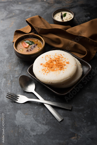 Thatte or Taste Idli also known as Plate Idly is a Popular south Indian Food, served with sambar and chutney.  photo