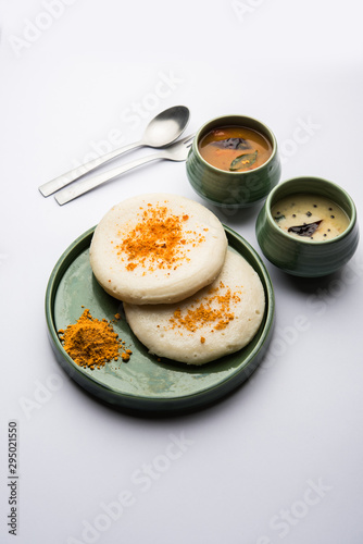 Thatte or Taste Idli also known as Plate Idly is a Popular south Indian Food, served with sambar and chutney.  photo