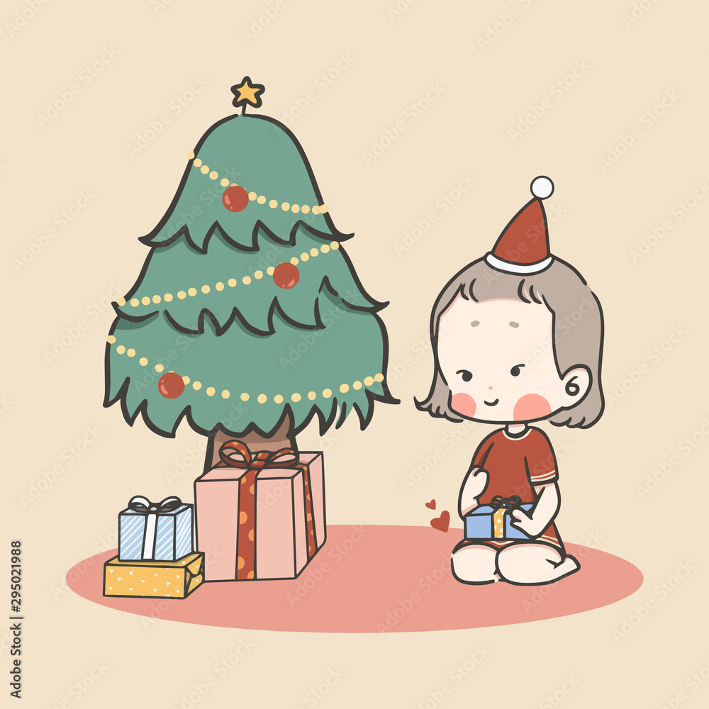 Happy cute little child girl happy with Christmas gift box with Christmas tree