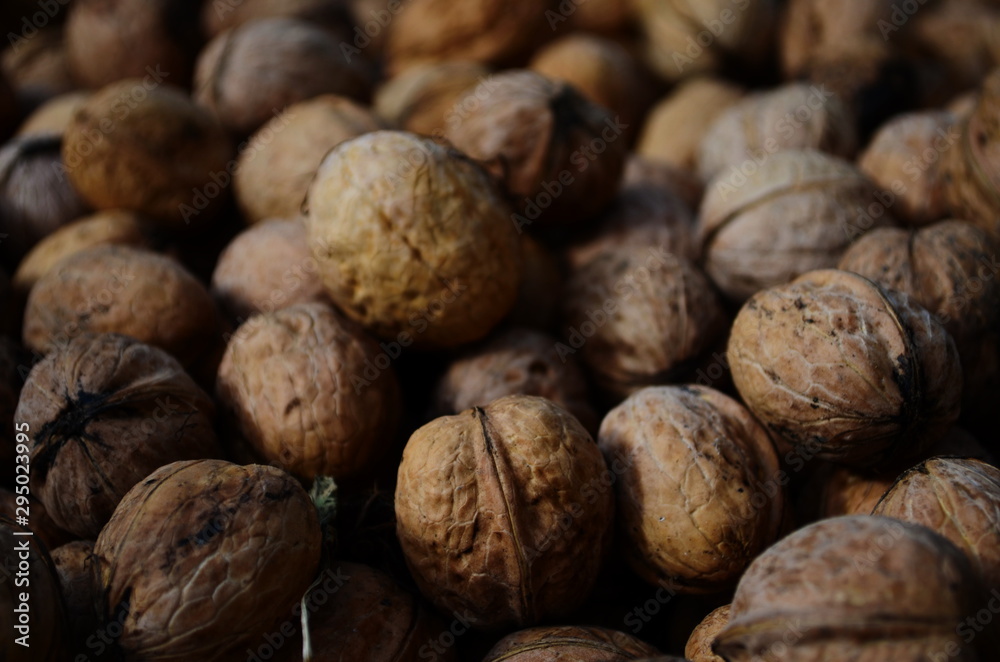 Natural walnut background pattern texture Abstract walnuts heap pattern background Blurred edges frame Natural food in-shell nuts walnuts Natural walnut background pattern texture Abstract walnuts heap pattern background Blurred edges frame Natural food in-shell nuts walnuts