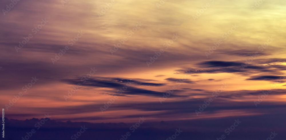 Dramatic orange sunset sky. Romantic sky. Colorful sunset. Art picture of sky at sunset. Sunset sky and clouds for inspiration background. Nature background. Peaceful and tranquil concept.