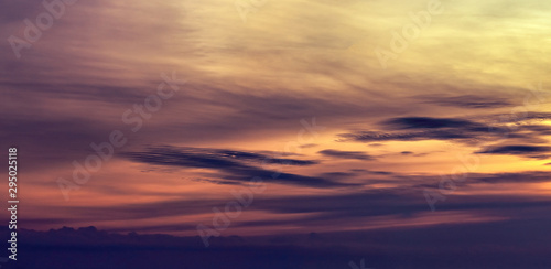 Dramatic orange sunset sky. Romantic sky. Colorful sunset. Art picture of sky at sunset. Sunset sky and clouds for inspiration background. Nature background. Peaceful and tranquil concept. © Artinun