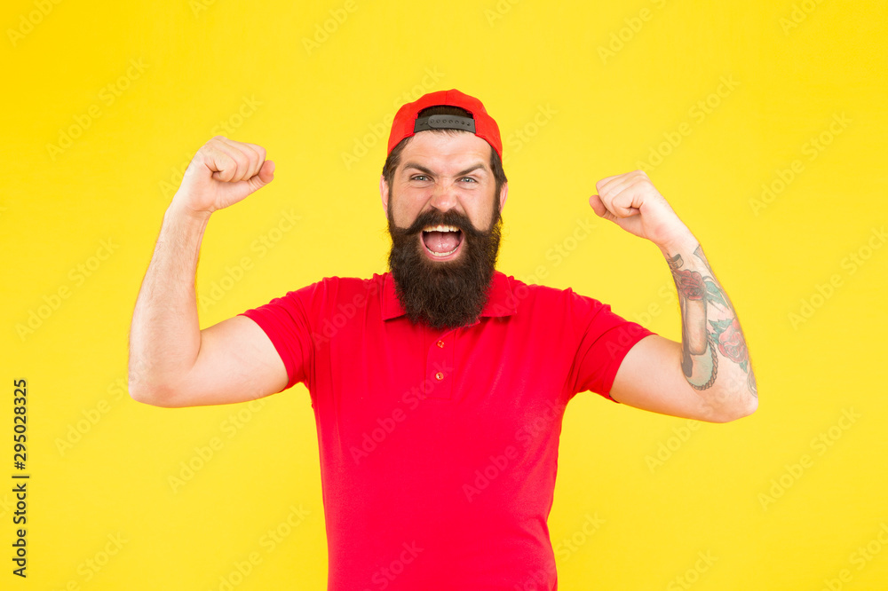 Naklejka premium Total win. Man happy satisfied smiling expression. Man happy face. Happiness concept. Psychological health. Happy emotional guy. Positive emotions. Happy man on yellow background. Winner. Lucky day