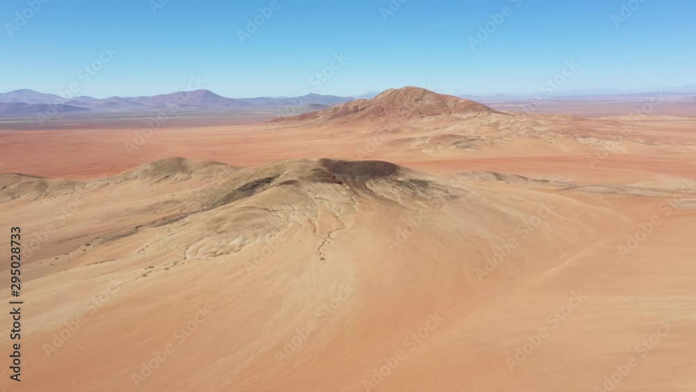 Exploring Atacama Desert vast dry extensions in the driest area of this amazing desert with an all terrain vehicle. An awe road trip adventure crossing the infinite sand extensions from an aerial view Exploring Atacama Desert vast dry extensions in the driest area of this amazing desert with an all terrain vehicle. An awe road trip adventure crossing the infinite sand extensions from an aerial view