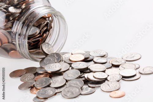 US coins in a jar isolated on white background