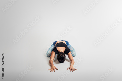 Yoga child pose, stretching, woman on white backgroung, studio photos