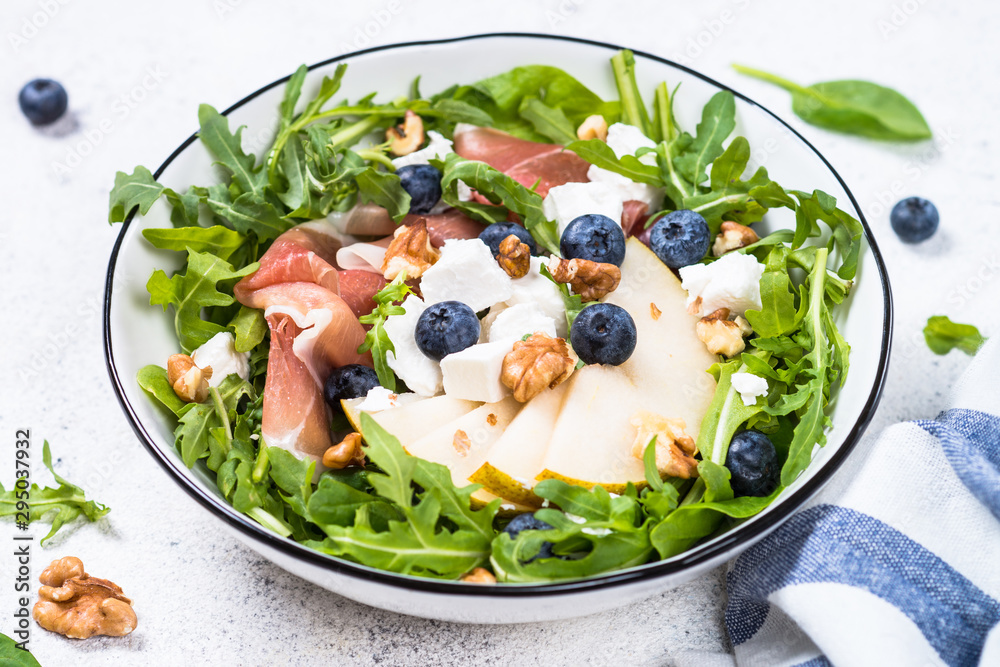 Green salad with leaves, fruit and jamon. Green salad with leaves, fruit and jamon.