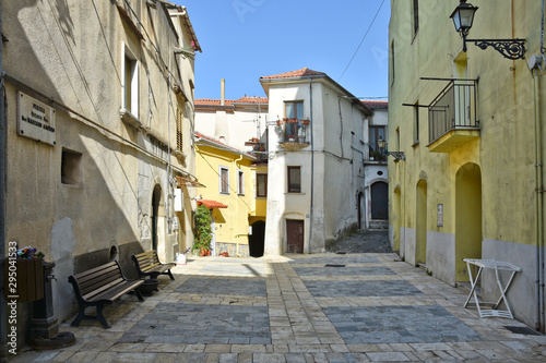 Fototapeta Naklejka Na Ścianę i Meble -  Province of Salerno, Italy, 10/10/2016. A small street among the old houses of  Contursi, a medieval village.