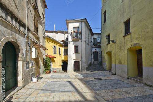 Fototapeta Naklejka Na Ścianę i Meble -  Province of Salerno, Italy, 10/10/2016. A small street among the old houses of Contursi, a medieval village.