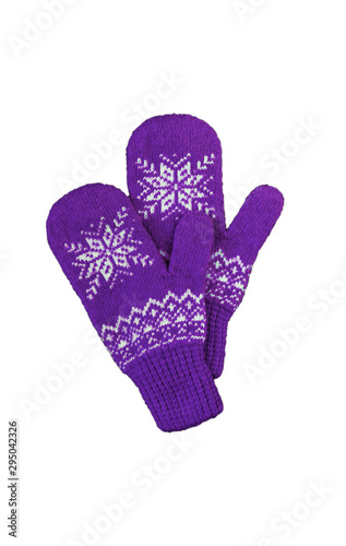 pair of pink lilac purple knitted mittens with christmas pattern isolated on