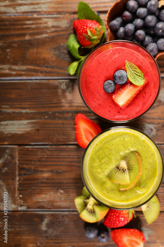 fruit juice, smoothie with strawberry, blueberry and kiwi - top view