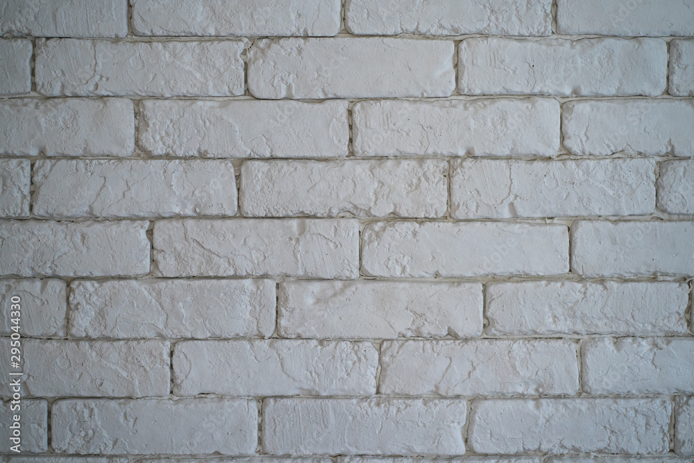 A wall of white bricks. A wall of white bricks.