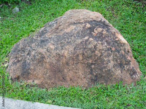 stone on green grass in the garden