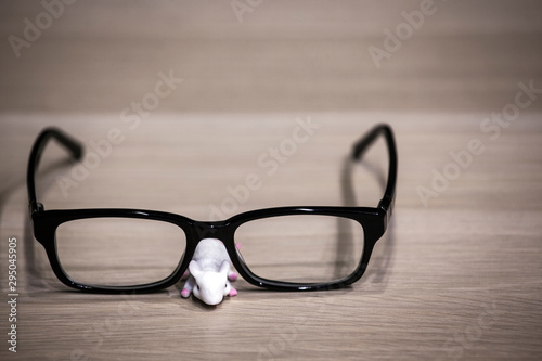 mouse glasses wooden table background 