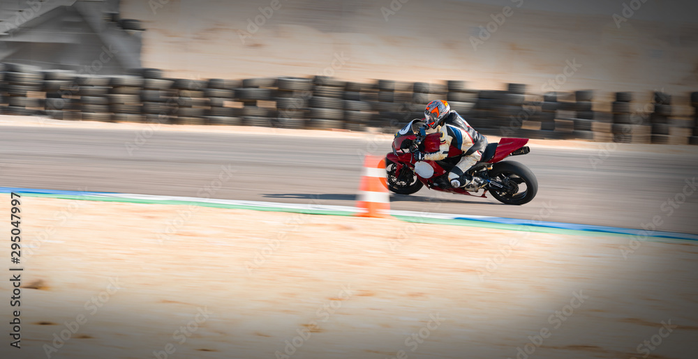 motorcycle racer rides on a sports track