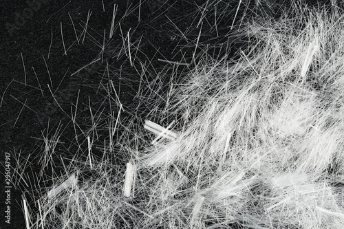Top down view of bundles of white micro polypropylene fiber for concrete structural reinforcement.