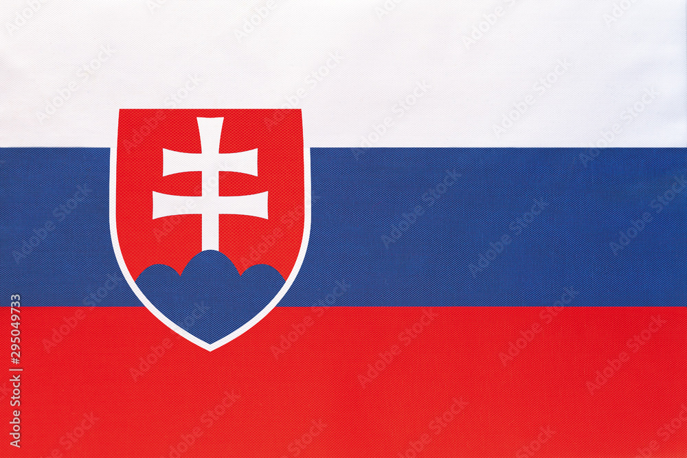 Fototapeta premium Slovakia national fabric flag, textile background. Symbol of international world european country.