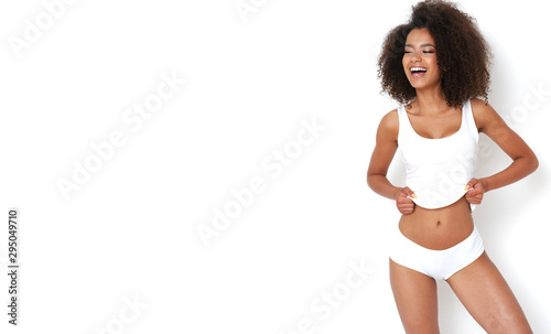 Beautiful afro girl in white shirt and panties showing her beauty body.