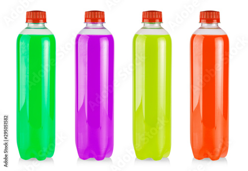 The plastic bottles with colored juice on white