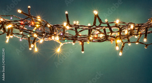 holiday banner of Christmas lights on blue background