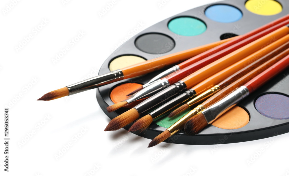 Obraz premium Color palette with brushes, painting utensils isolated on white background