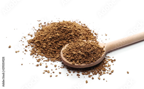 Instant coffee granules with wooden spoon, isolated on white background