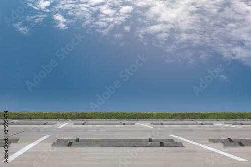 Empty parking lot on blue sky background