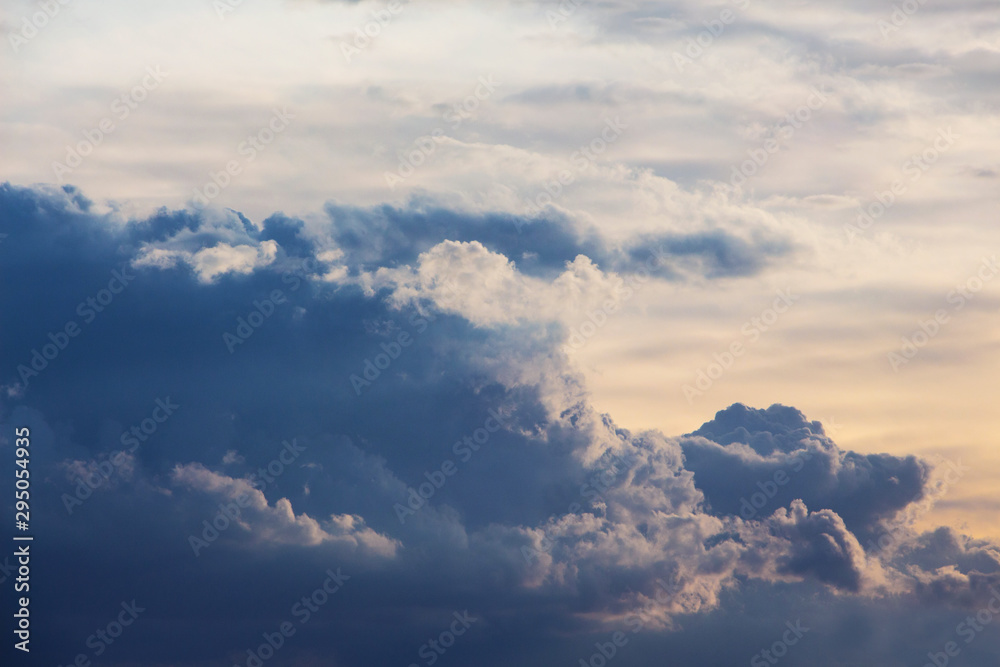 Blue curly clouds in the evening sky_ Blue curly clouds in the evening sky_