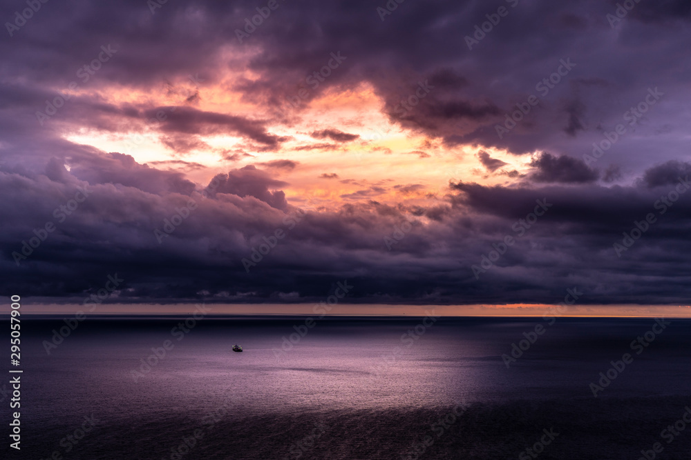 Dramatic panoramic view of the sea and moody cloudy sky