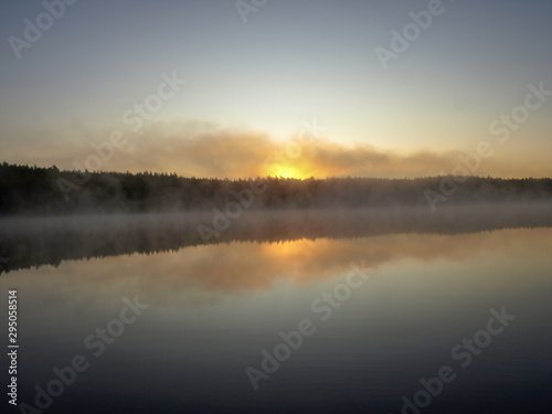 beautiful mist on the lake, outline, sunrise, autumn morning © ANDA