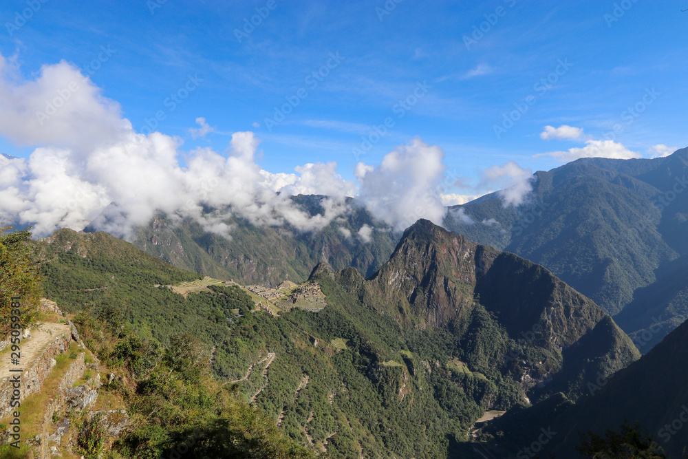 Peru - Machu Picchu - Stunning views over Machu Picchu as the cloud clears for the day to reveal this stunning archaeological wonder - ruins, construction, altitude, hills, mountains 