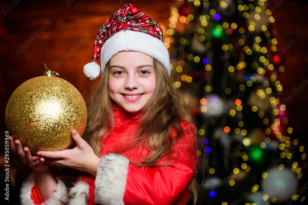 Christmas decorations. Love to decorate everything around. Sparkling big toy. Merry christmas. Festive atmosphere christmas day. Girl santa claus costume hold big ball christmas tree ornaments Christmas decorations. Love to decorate everything around. Sparkling big toy. Merry christmas. Festive atmosphere christmas day. Girl santa claus costume hold big ball christmas tree ornaments