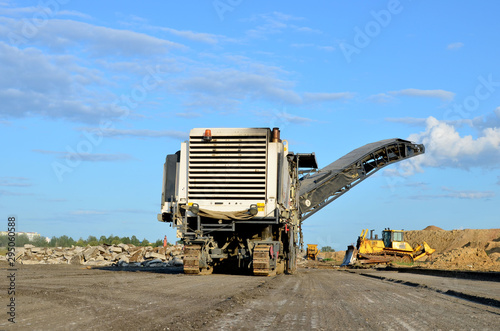 Cold milling machines are used for the quick, highly efficient removal of asphalt and concrete pavements. Removing and grinding the road surface, road construction and road rehabilitation - Image